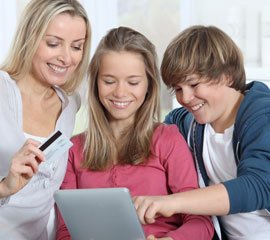 Woman, boy and girl looking at tablet
